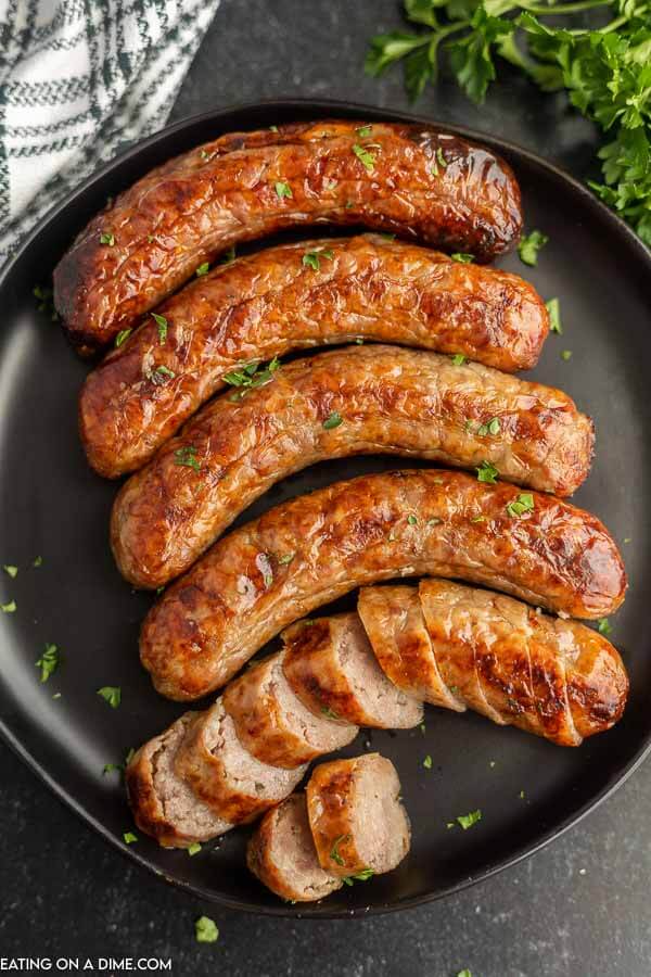 Air fryer brats on a plate. 
