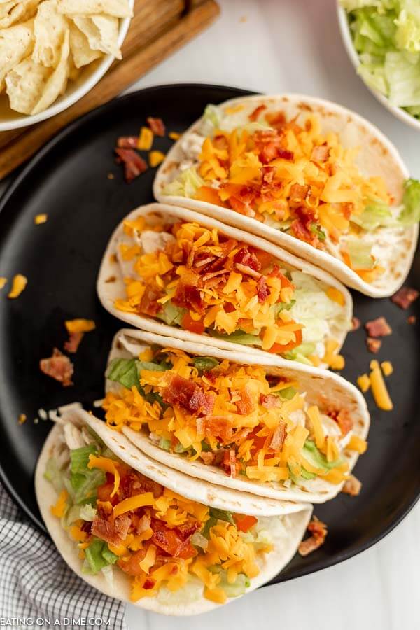 Chicken Bacon Ranch Tacos on a black plate. 