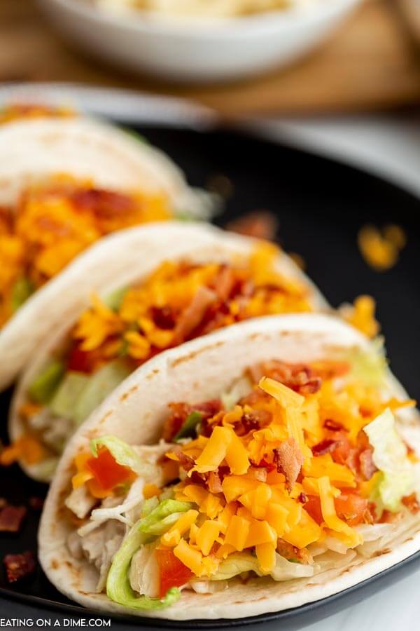 Chicken Bacon Ranch Tacos on a black plate. 