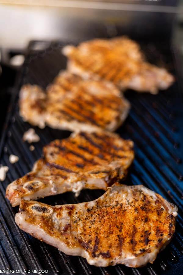 Grilled bone in pork chops on the grill. 