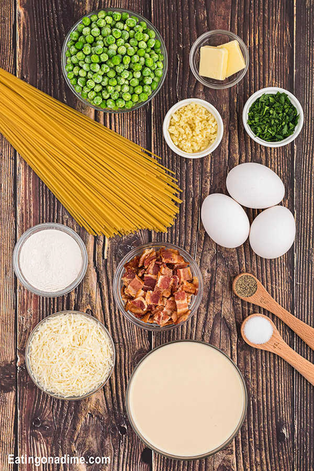 Ingredients for Cheesecake factory pasta carbonara. Spaghetti noodles, frozen peas, bacon, butter, garlic, eggs, parmesan cheese, flour, evaporated milk, salt and pepper, parsley