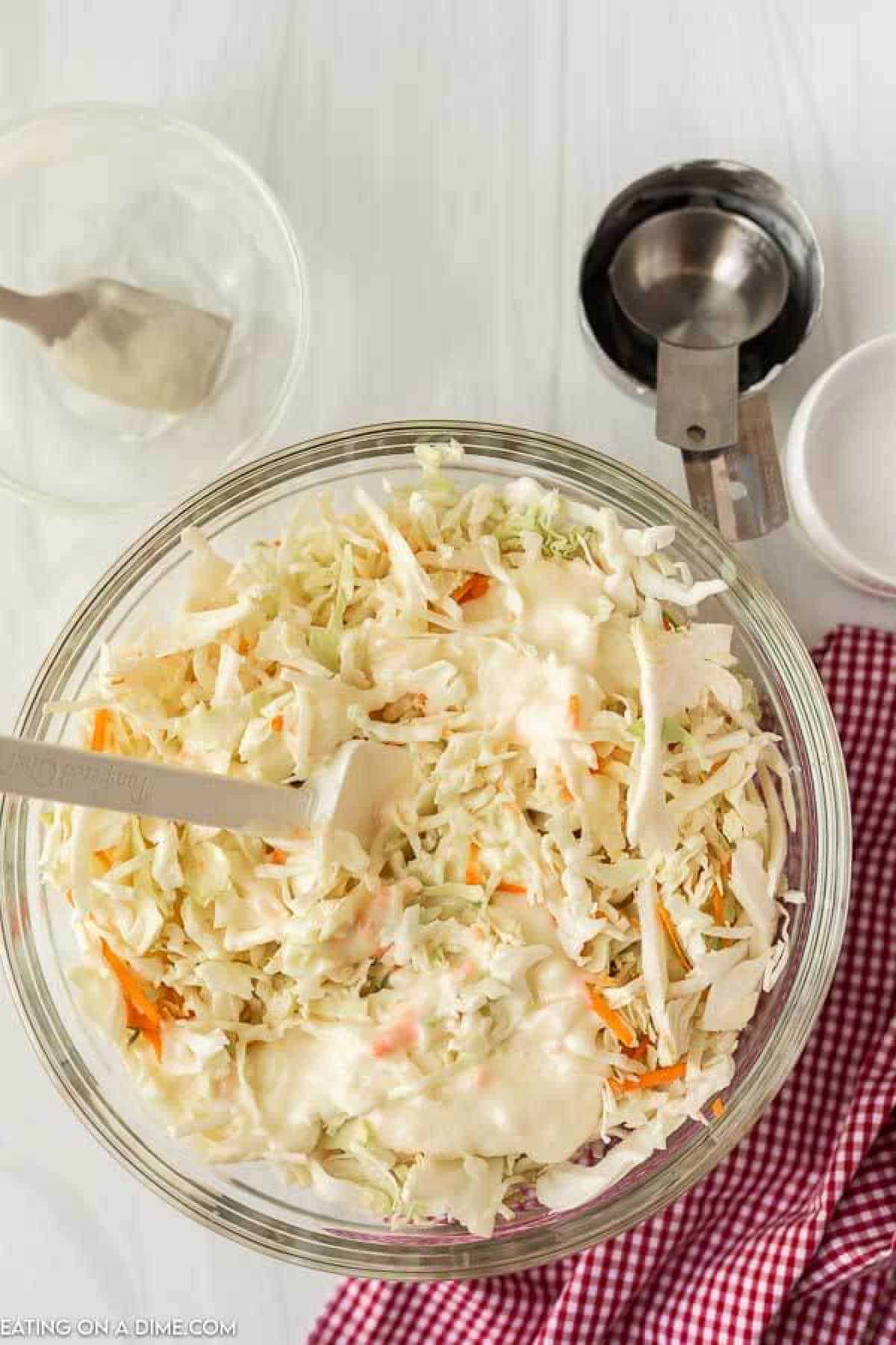 Combining the ingredients in a mixing bowl.