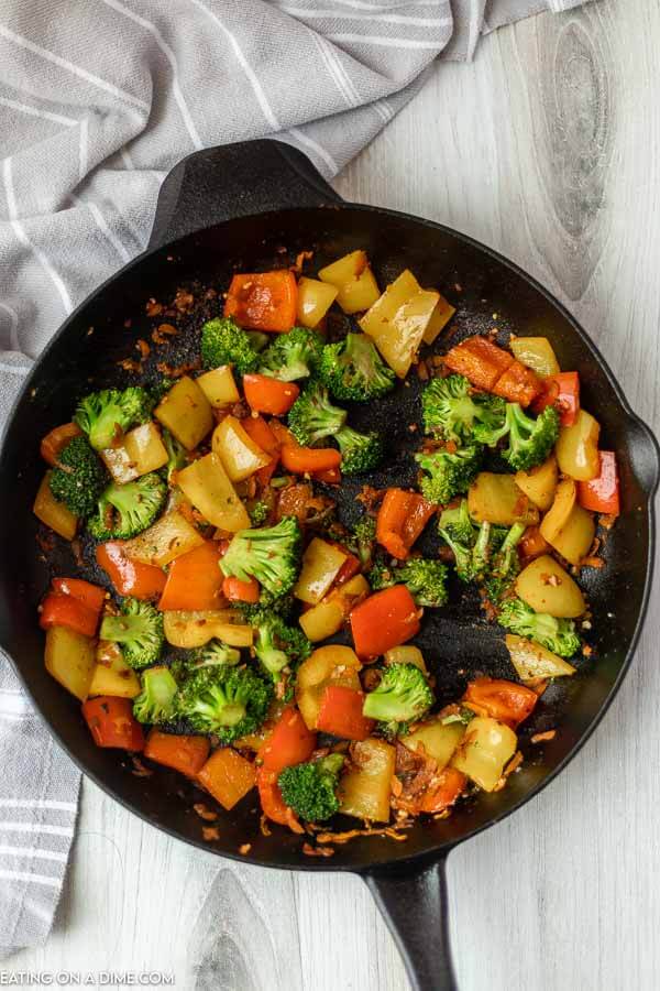 Cooking the vegetables in a iron skillet