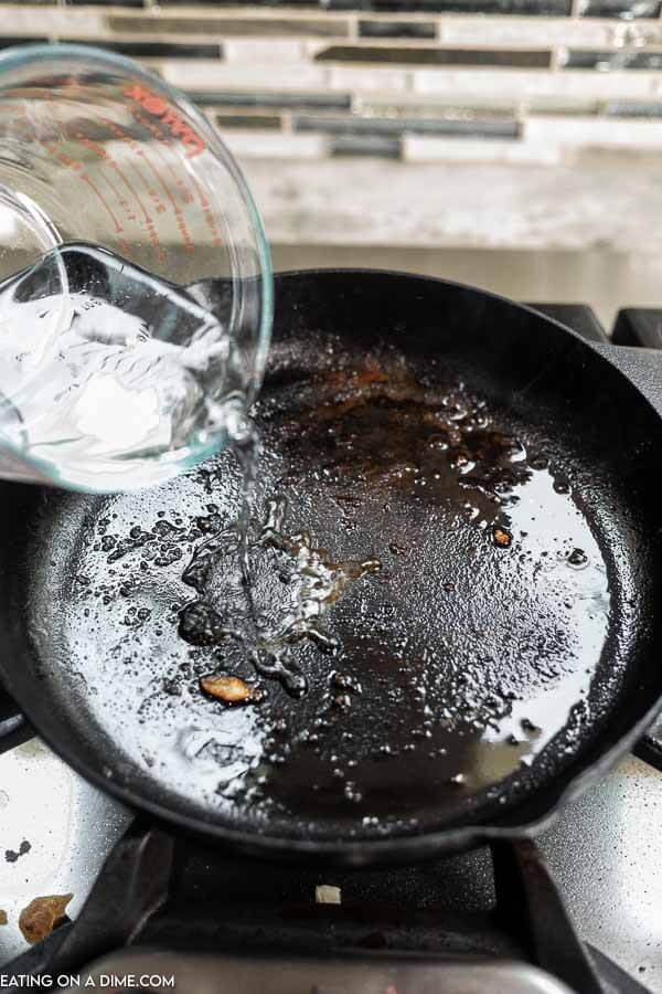 Pouring water in a cast iron skillet 