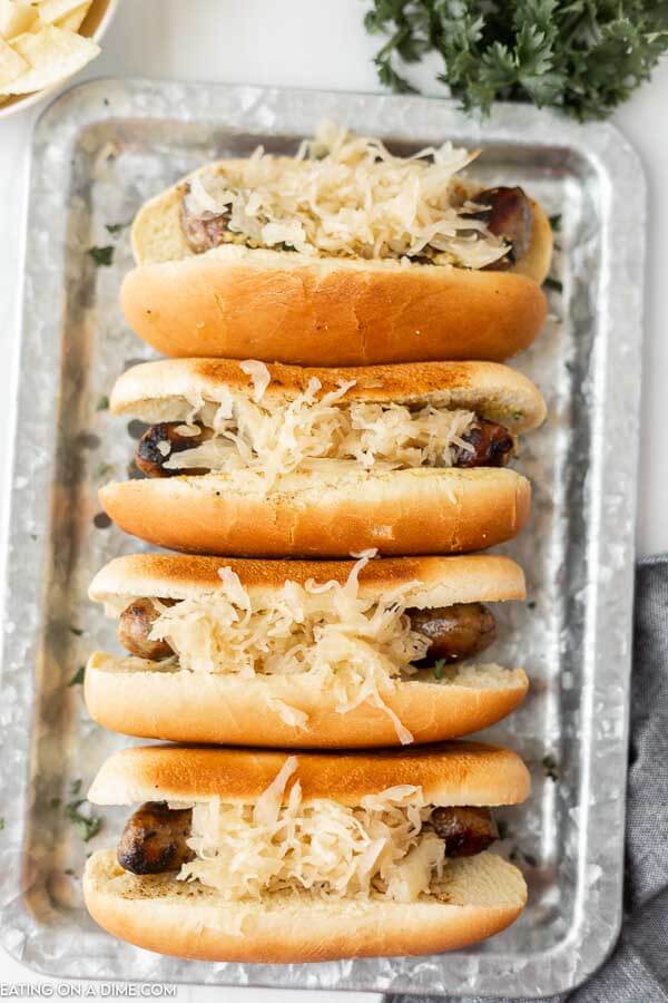 Grilled brats on a bun. 