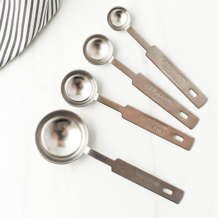 Close up image of teaspoons and tablespoons