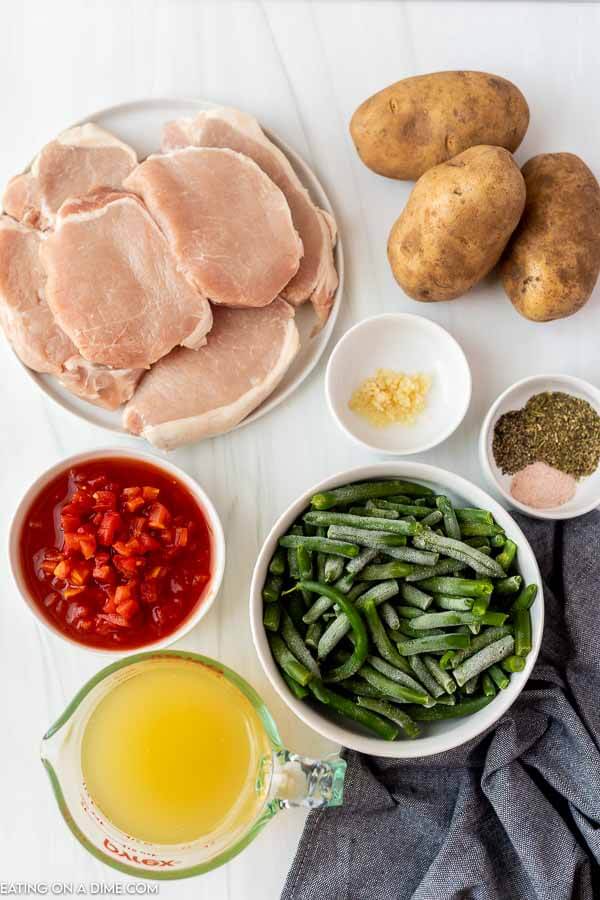 Ingredients needed - pork chops, olive oil, potatoes, green beans, diced tomatoes, italian seasoning, minced garlic, salt and pepper, chicken broth