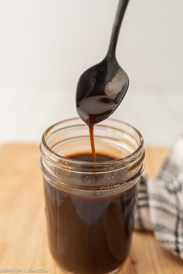 Worcestershire Sauce in a jar with a spoon