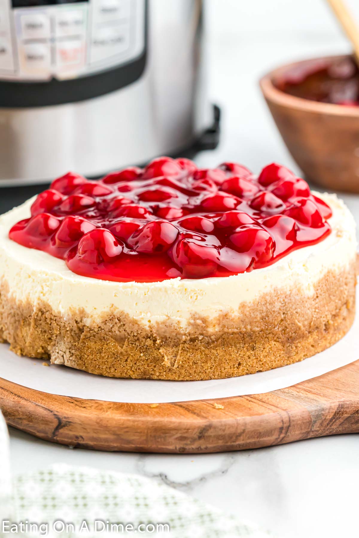 Instant Pot Cheesecake topped with cherries. 