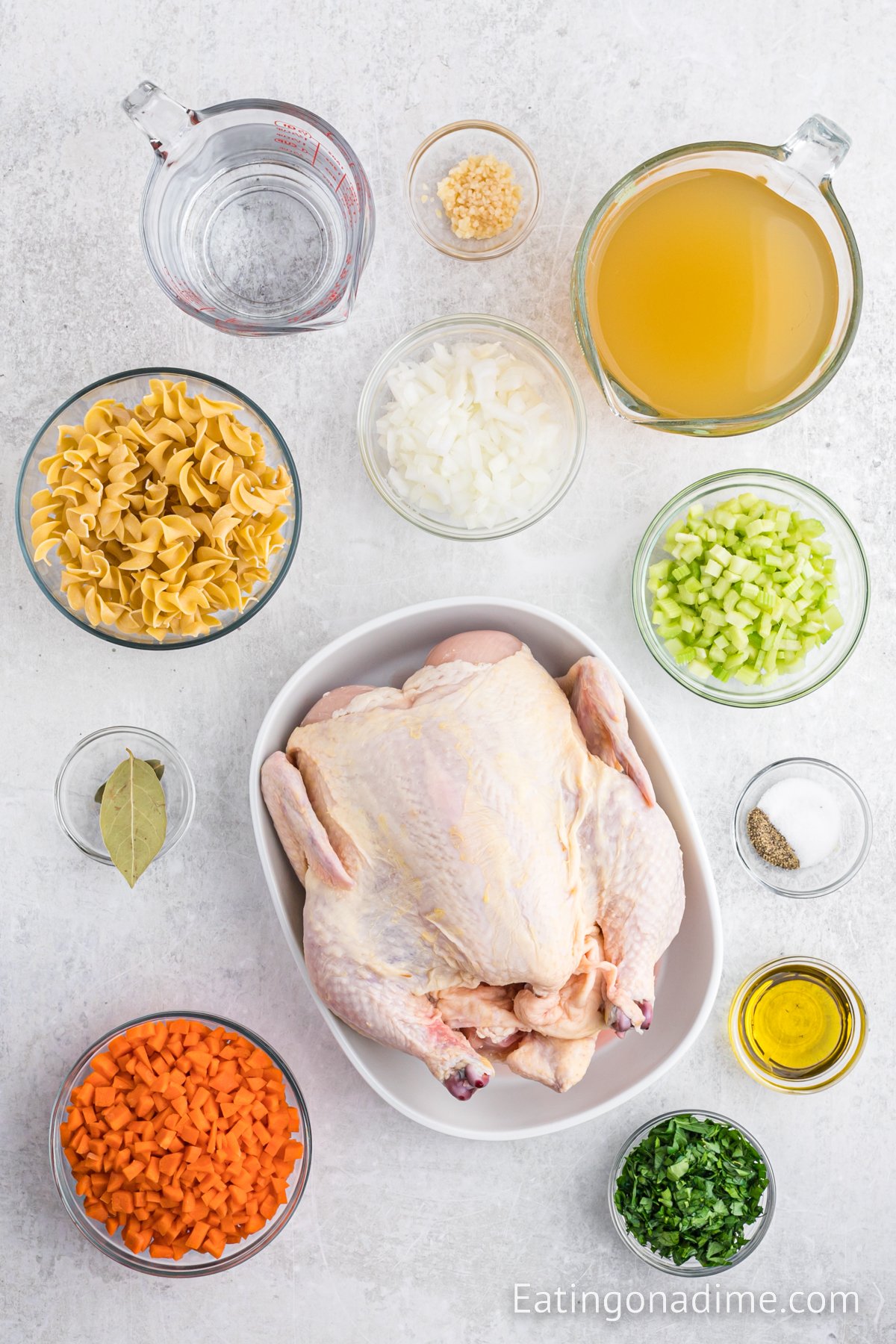 Ingredients needed - olive oil, minced garlic, onion, celery, carrots, chicken broth, water, whole chicken, bay leaves, fresh parsley, egg noodles, salt and pepper