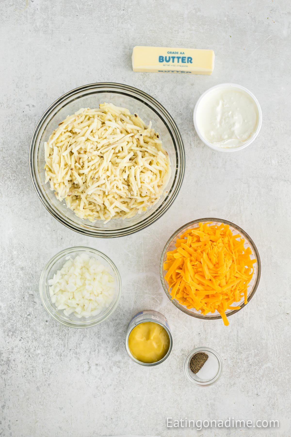 Ingredients needed - hashbrowns, butter, cream of chicken soup, sour cream, white onion, cheddar cheese, salt and pepper, parsley