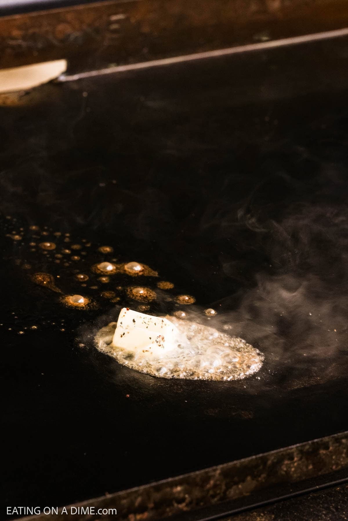 Melted butter on the flat top griddle.
