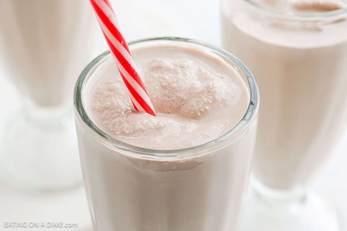 Chocolate Frosty in clear glass with a straw