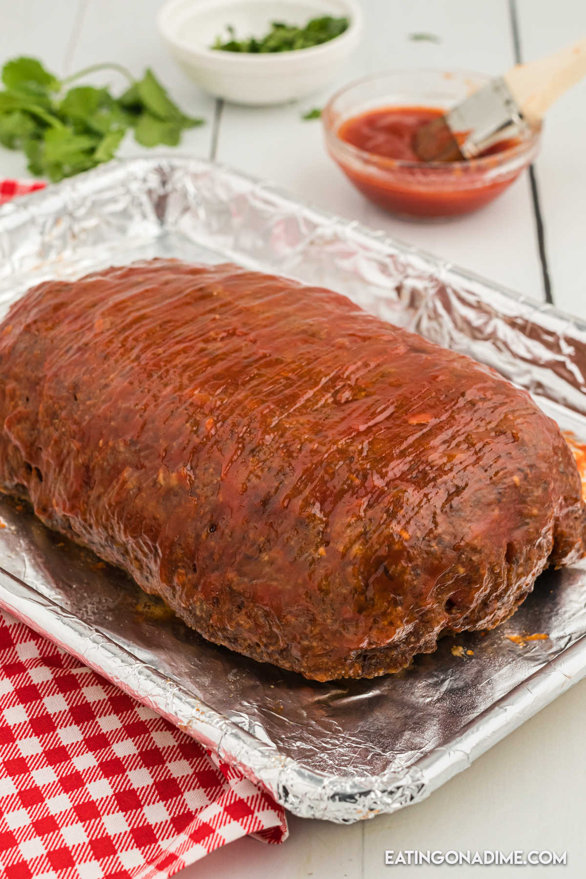 A whole meatloaf on a foil lined pan