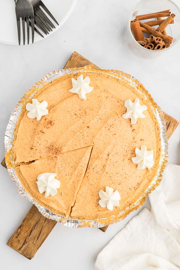 Whole no bake pumpkin pie topped with whipped topping