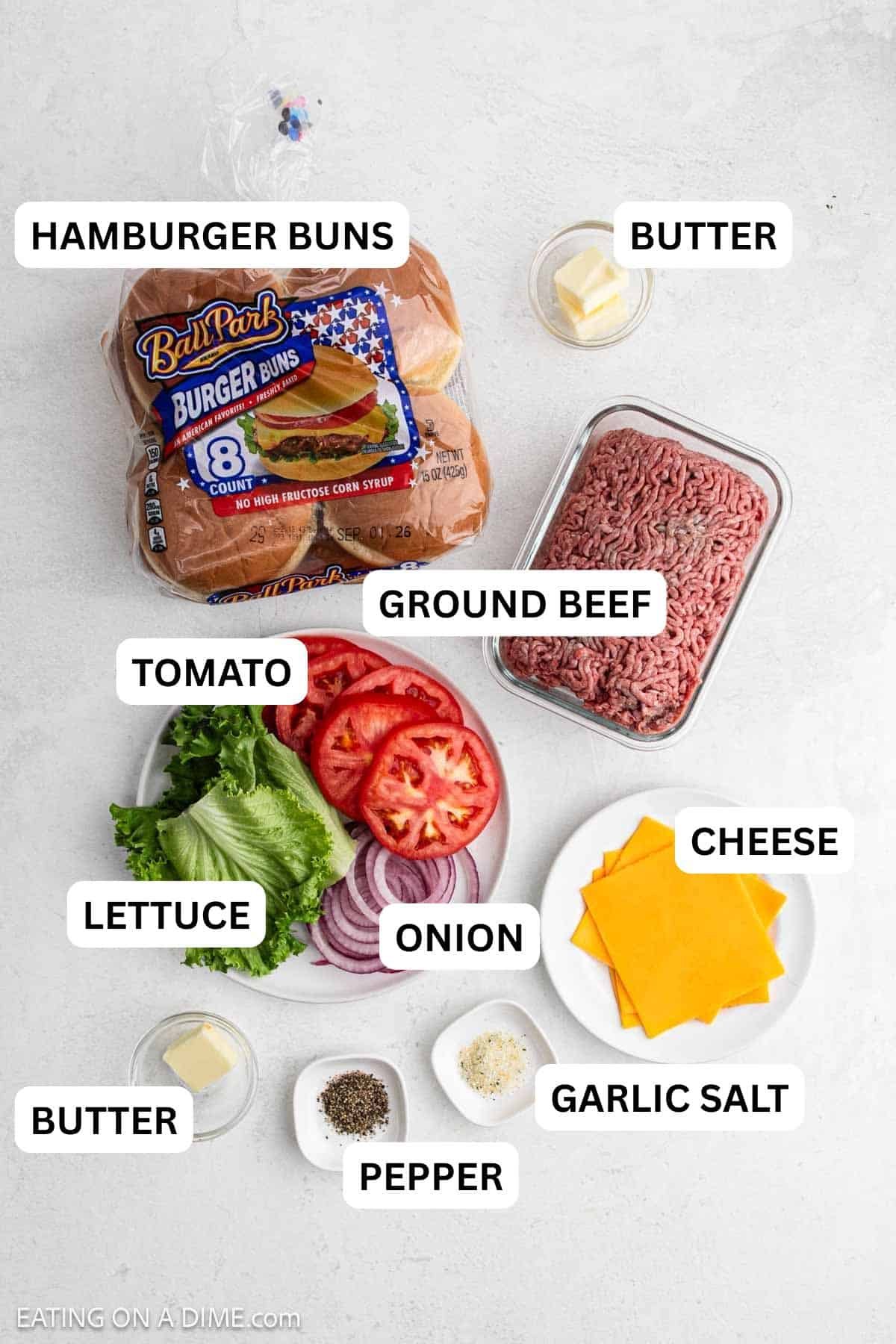 Ingredients needed for this recipe includes ground beef, butter, garlic salt, pepper, cheddar cheese, buns, lettuce, tomato and red onions.