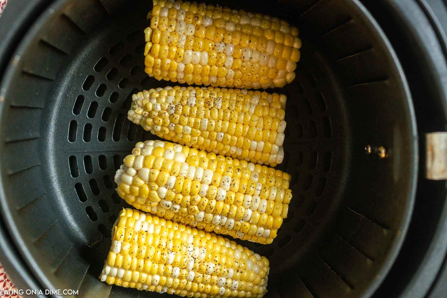 Freshly seasoned corn on the cob in the air fryer