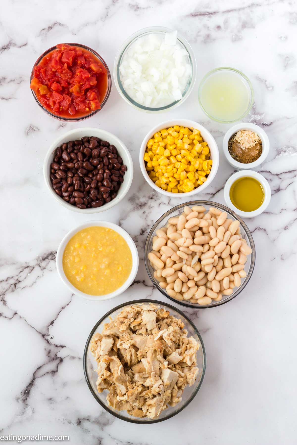 Ingredients needed - olive oil, onion, garlic, cumin, oregano, salt, cannellini beans, diced tomatoes, cream style corn, black beans, cooked chicken, lime