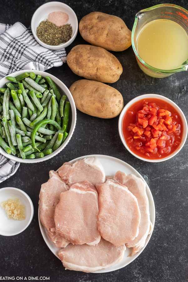 Ingredients needed - pork chops, potatoes, green beans, diced tomatoes, italian seasoning, minced garlic, salt and pepper