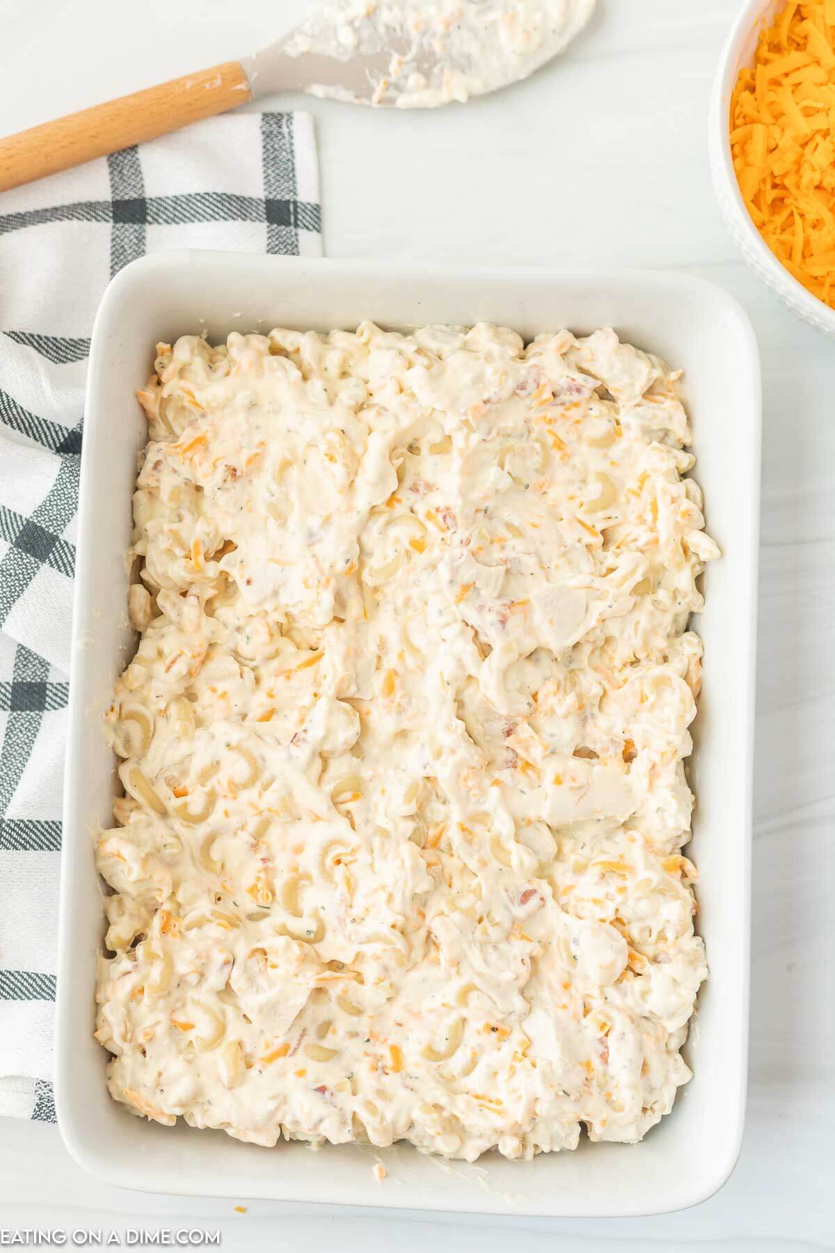 adding the chicken mixture in the baking dish