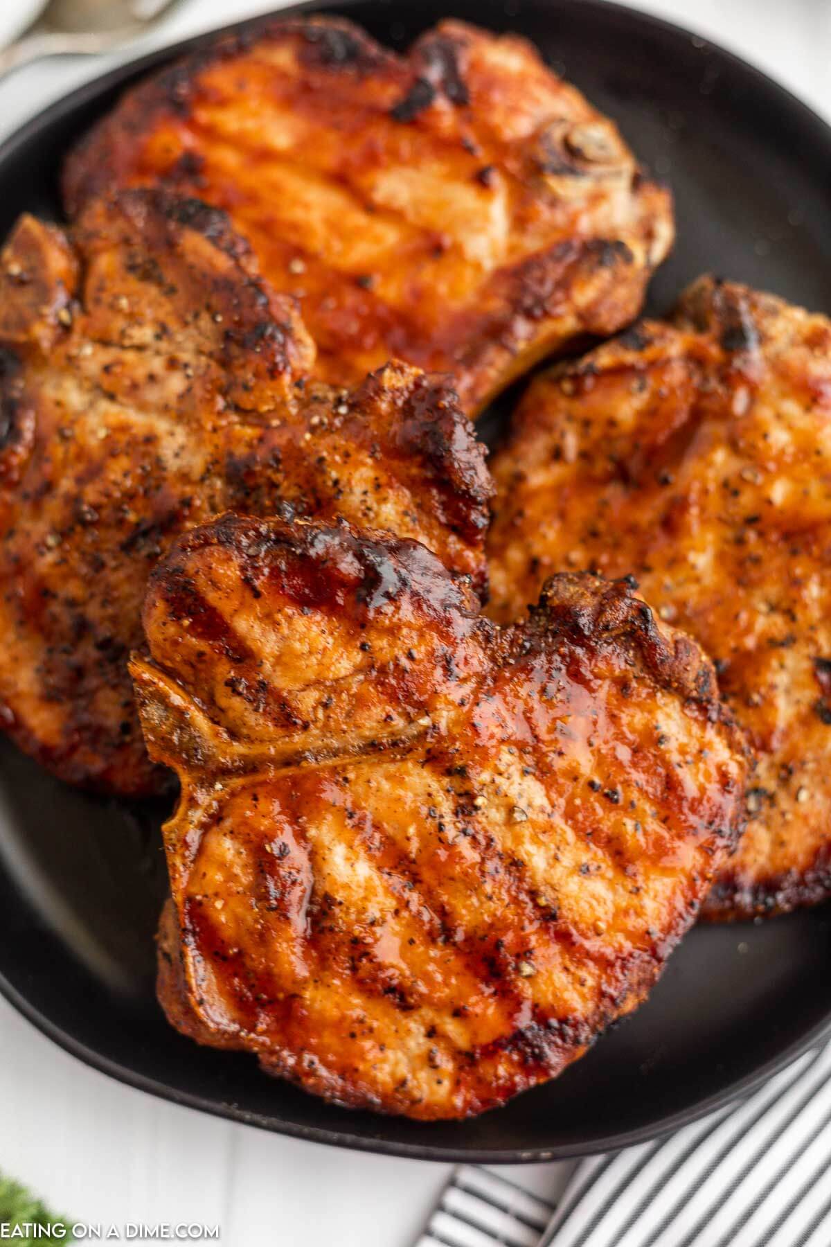 Grilled bbq pork chops on a plate. 