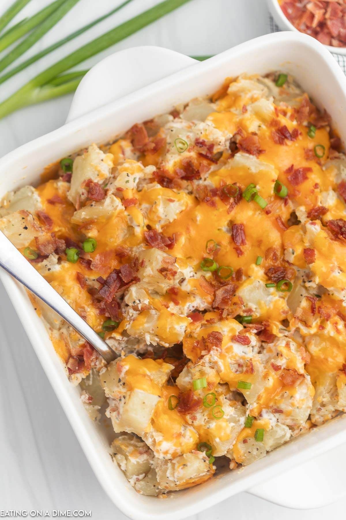 Crack potatoes in casserole dish. 