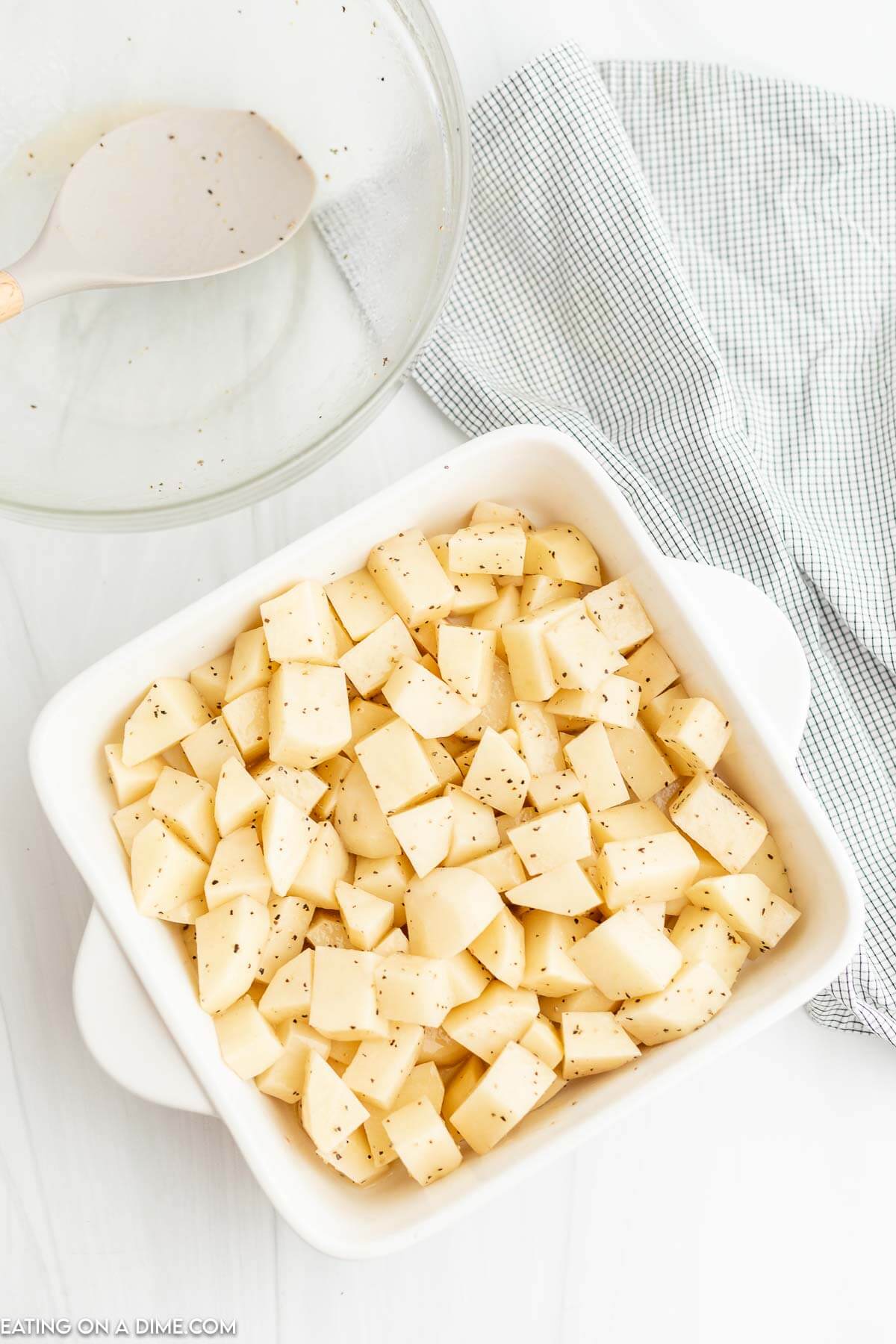 Diced potatoes in casserole dish. 