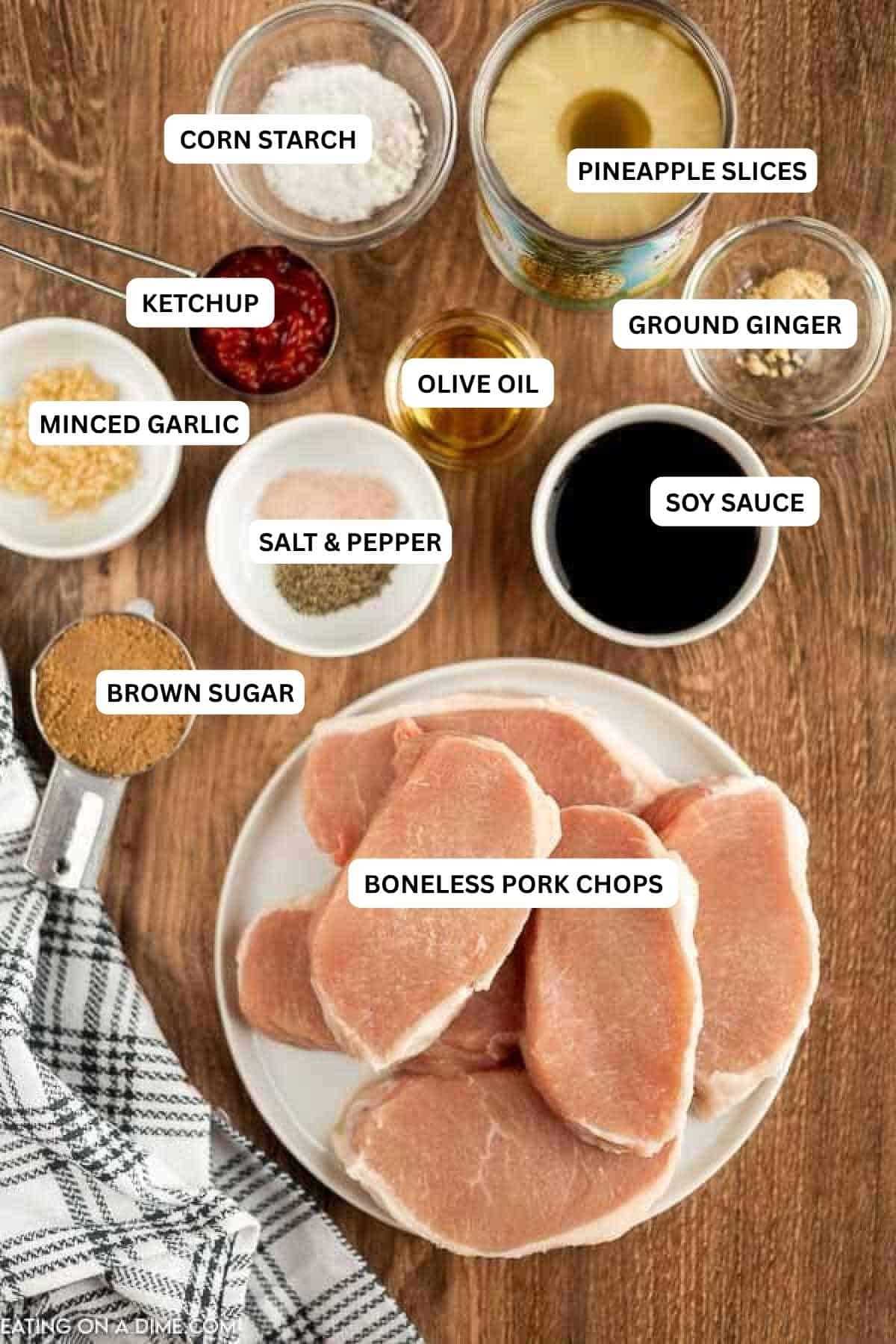 Ingredients for recipe: minced garlic, soy sauce, salt, pepper, brown sugar, pork chops, ginger, corn starch and pineapple slices.