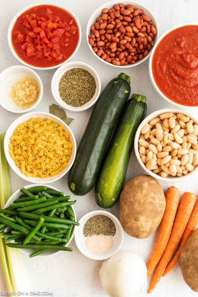 Ingredients needed - diced tomatoes, crushed tomatoes, carrots, potatoes, celery stalks, onion, minced garlic, italian seasoning, salt and pepper, bay leaves, vegetable stock, red kidney beans, cannellini beans, green beans, zucchini, pasta