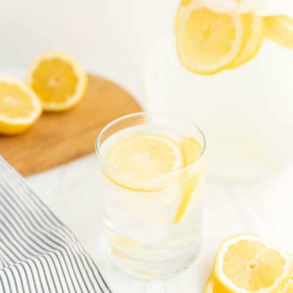 Lemon water in a pitcher. 