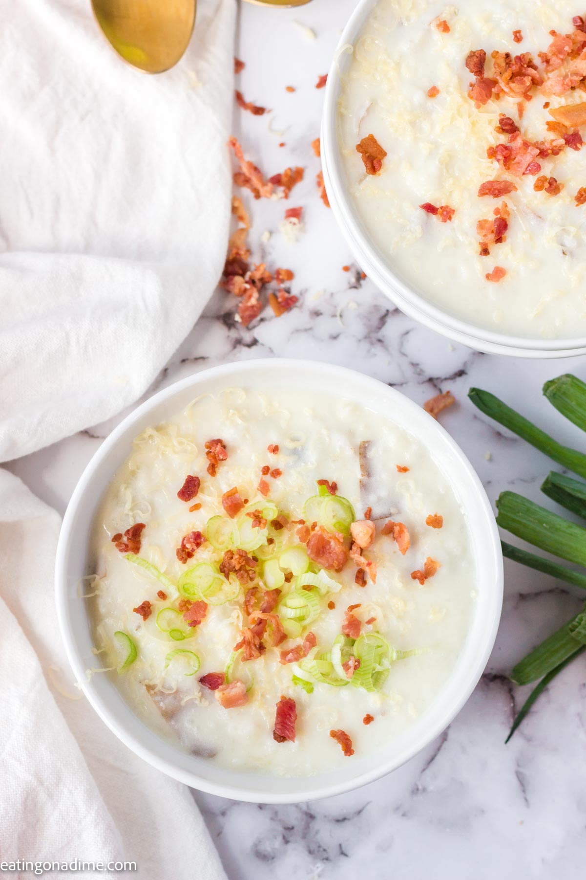 4 ingredient potato soup in a bowl with toppings. 