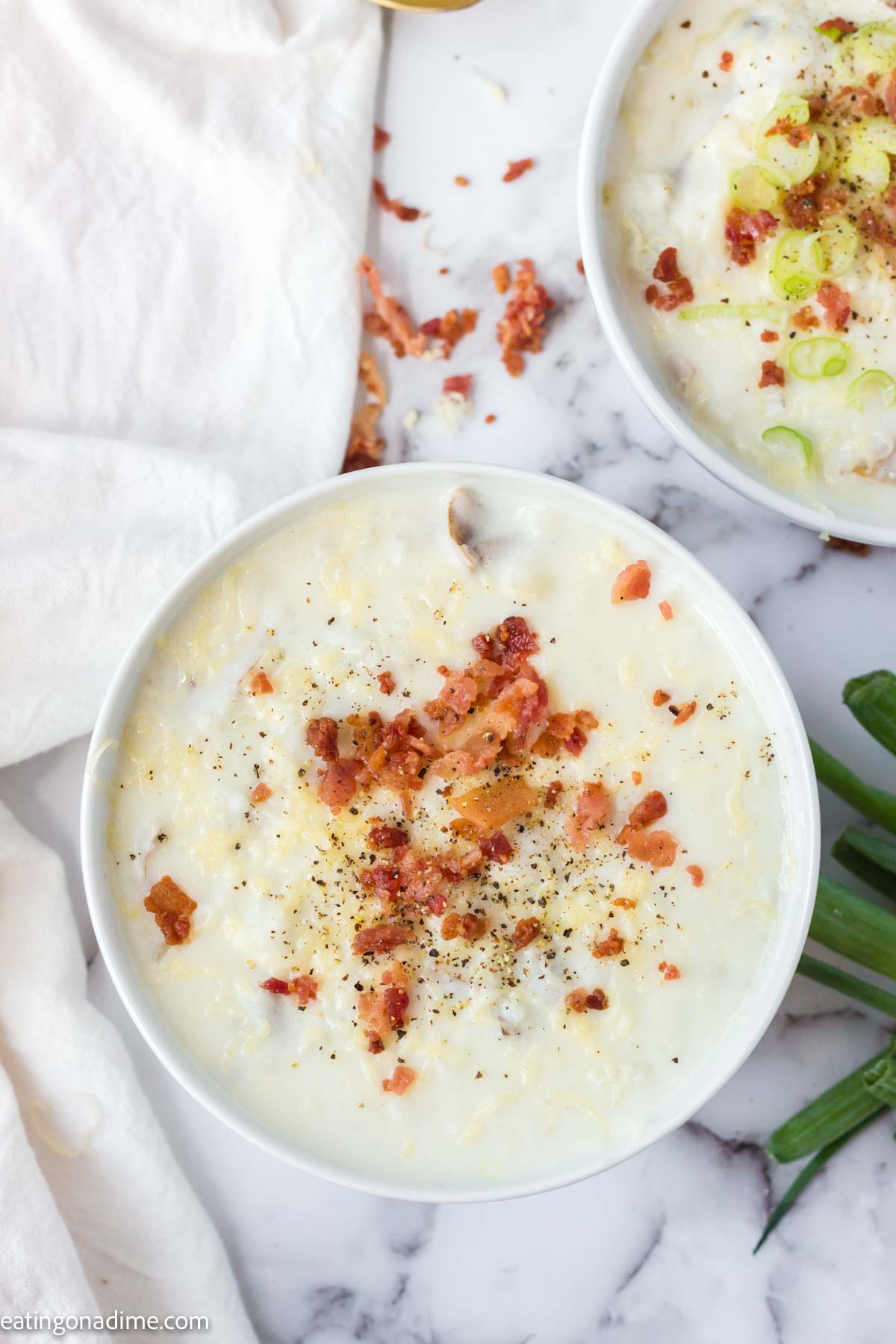 4 ingredient potato soup in a bowl with toppings.