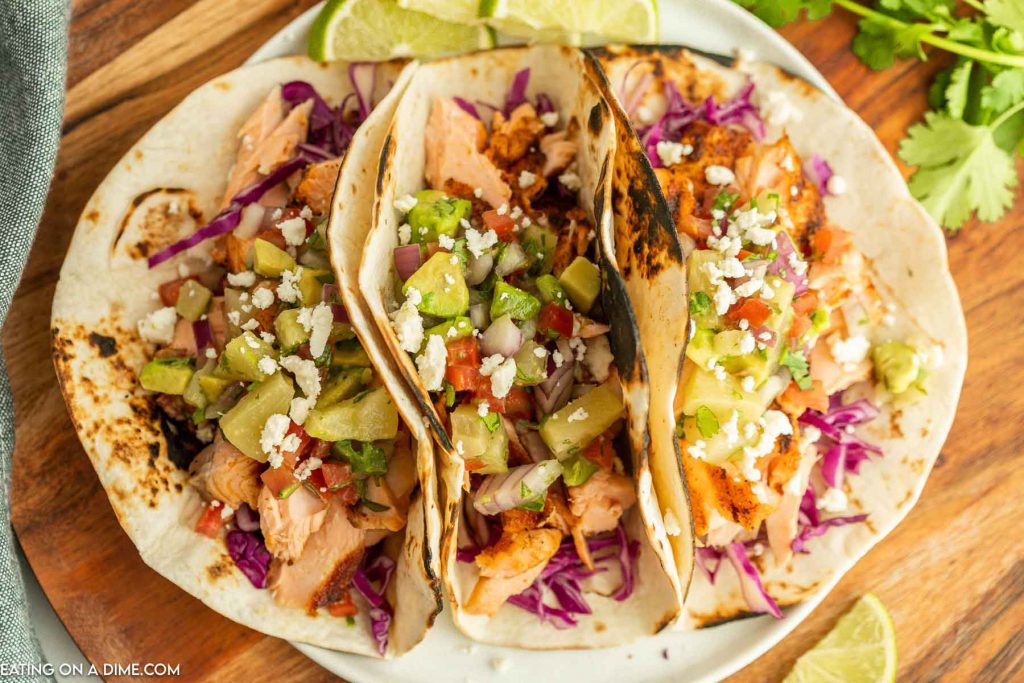 Grilled salmon tacos on a plate. 