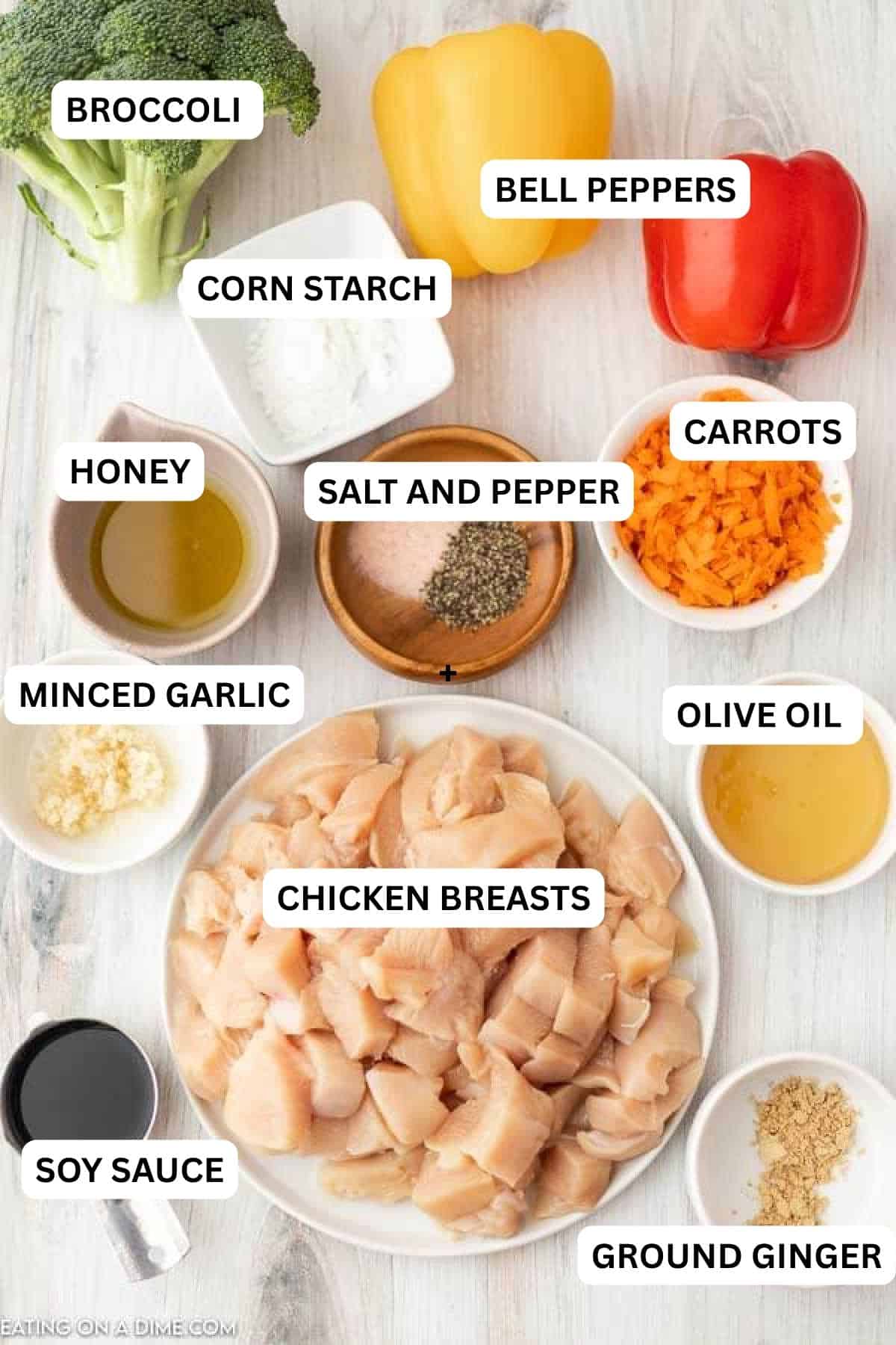 Ingredients for recipe - broccoli, bell peppers, corn starch, honey, salt and pepper, carrots, olive oil, minced garlic. chicken breasts, soy sauce and ground ginger.