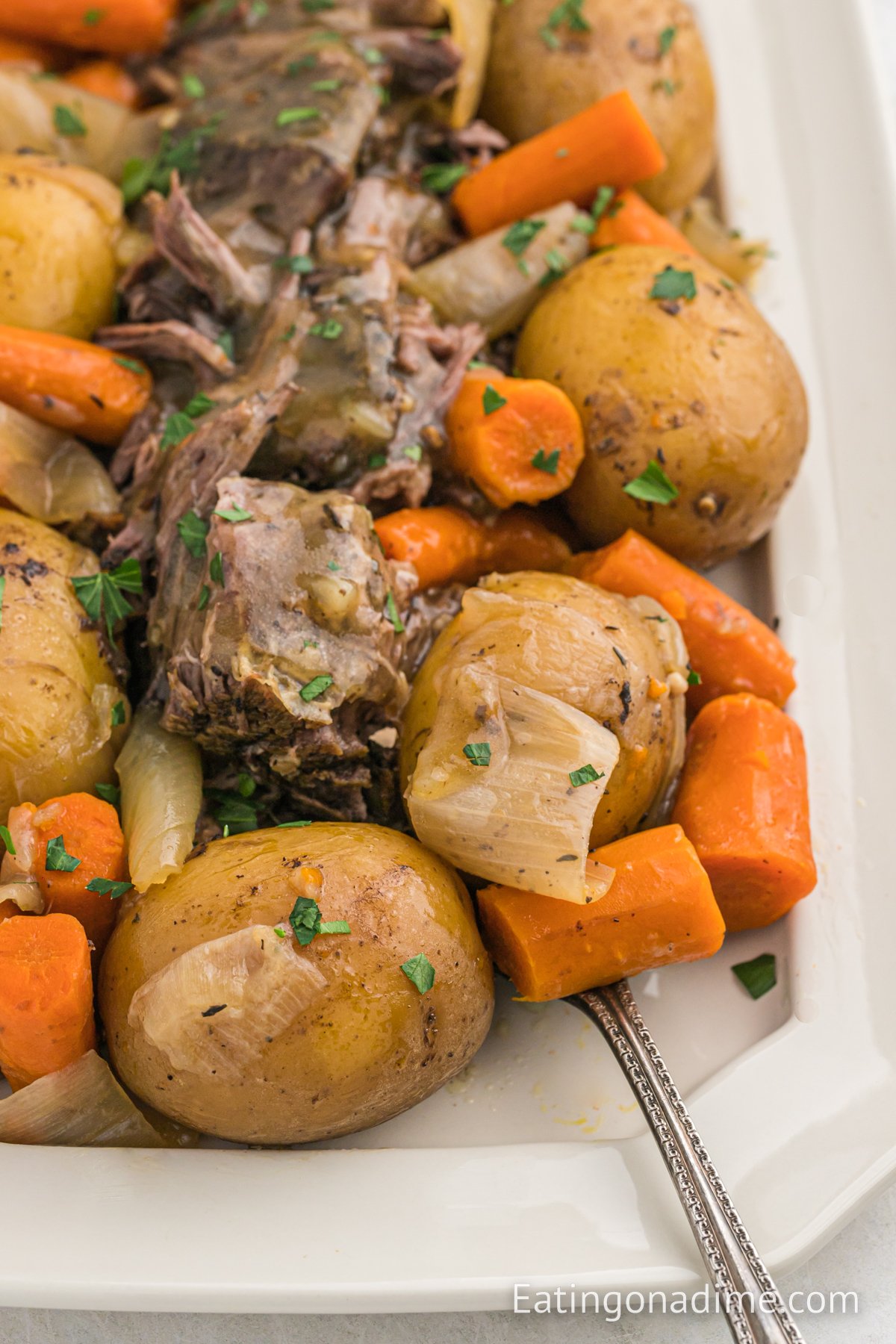 Chuck roast with potatoes and carrots on a platter