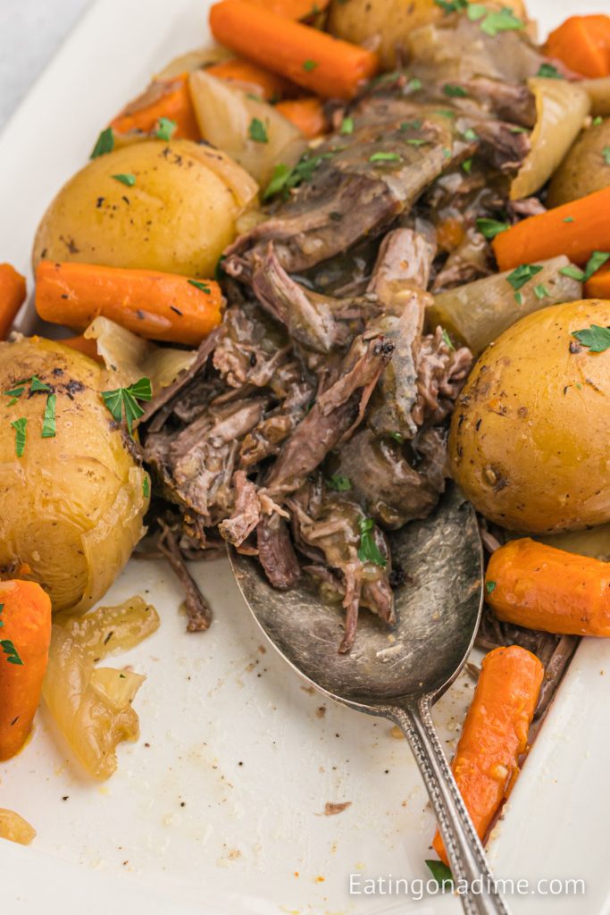 Chuck roast with potatoes and carrots on a platter