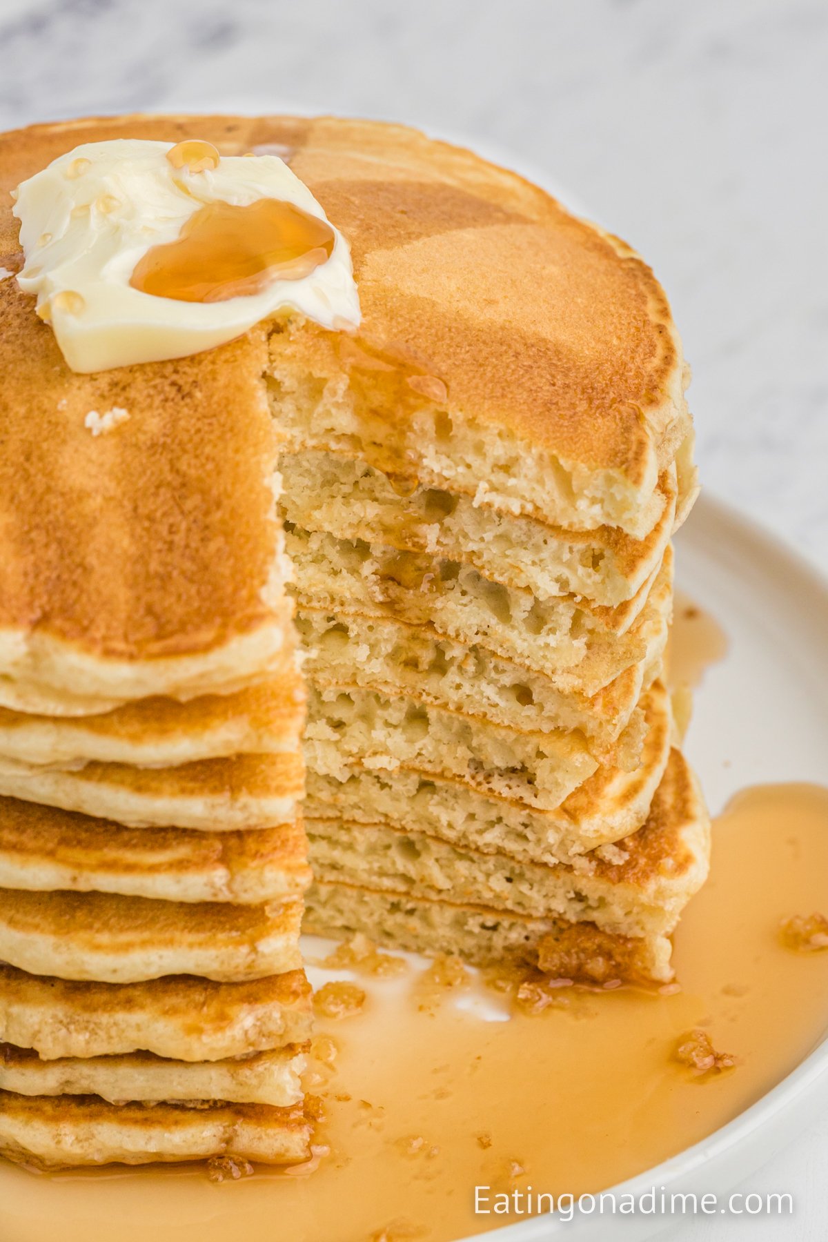 McDonalds pancakes stacked and topped with butter and syrup. 