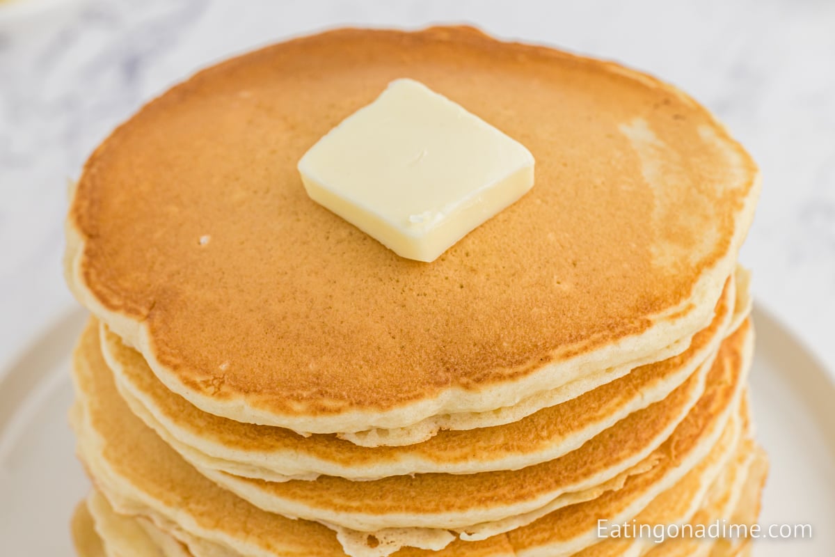 McDonalds pancakes stacked and topped with butter and syrup. 