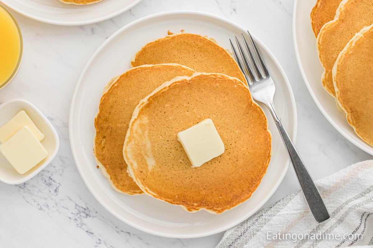 McDonalds pancakes stacked and topped with butter and syrup. 