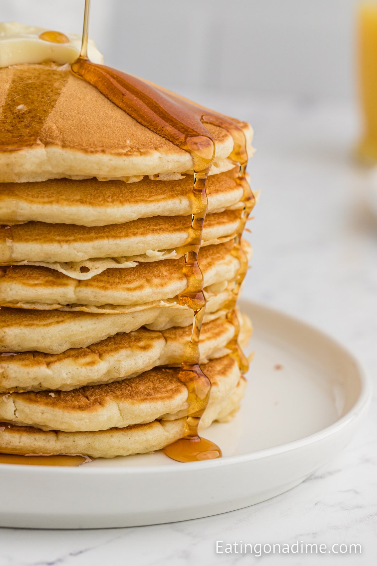 McDonalds pancakes stacked and topped with butter and syrup. 