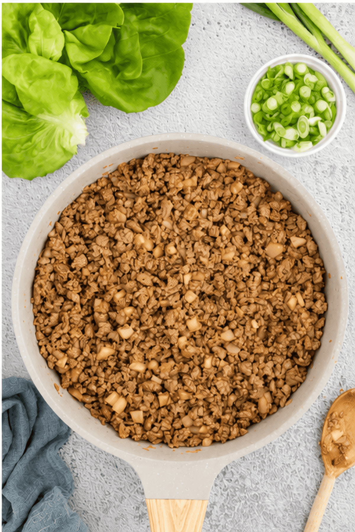 Cooked ground chicken mixture in a skillet.
