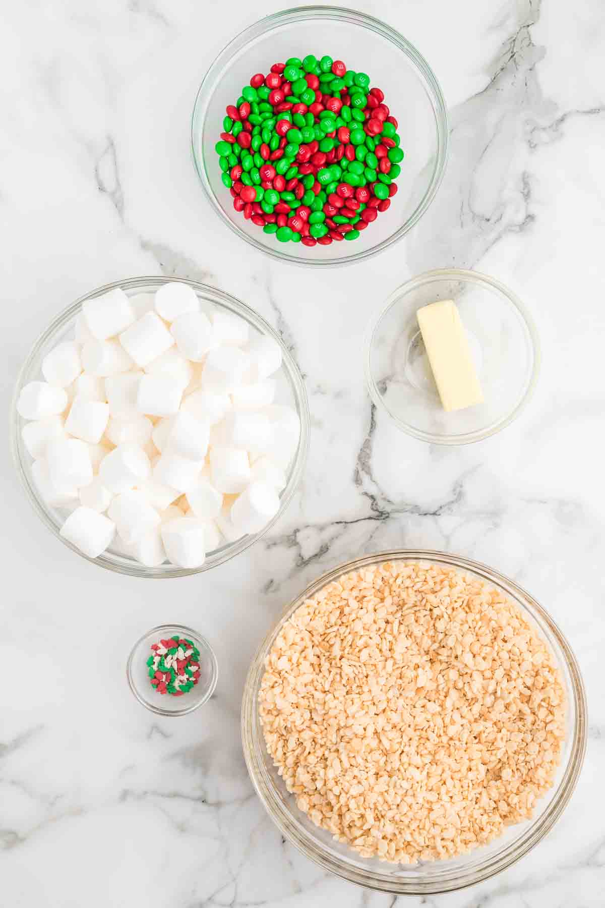 Ingredients needed - rice krispie cereal, butter, marshmallows, red and green m&ms christmas sprinkles