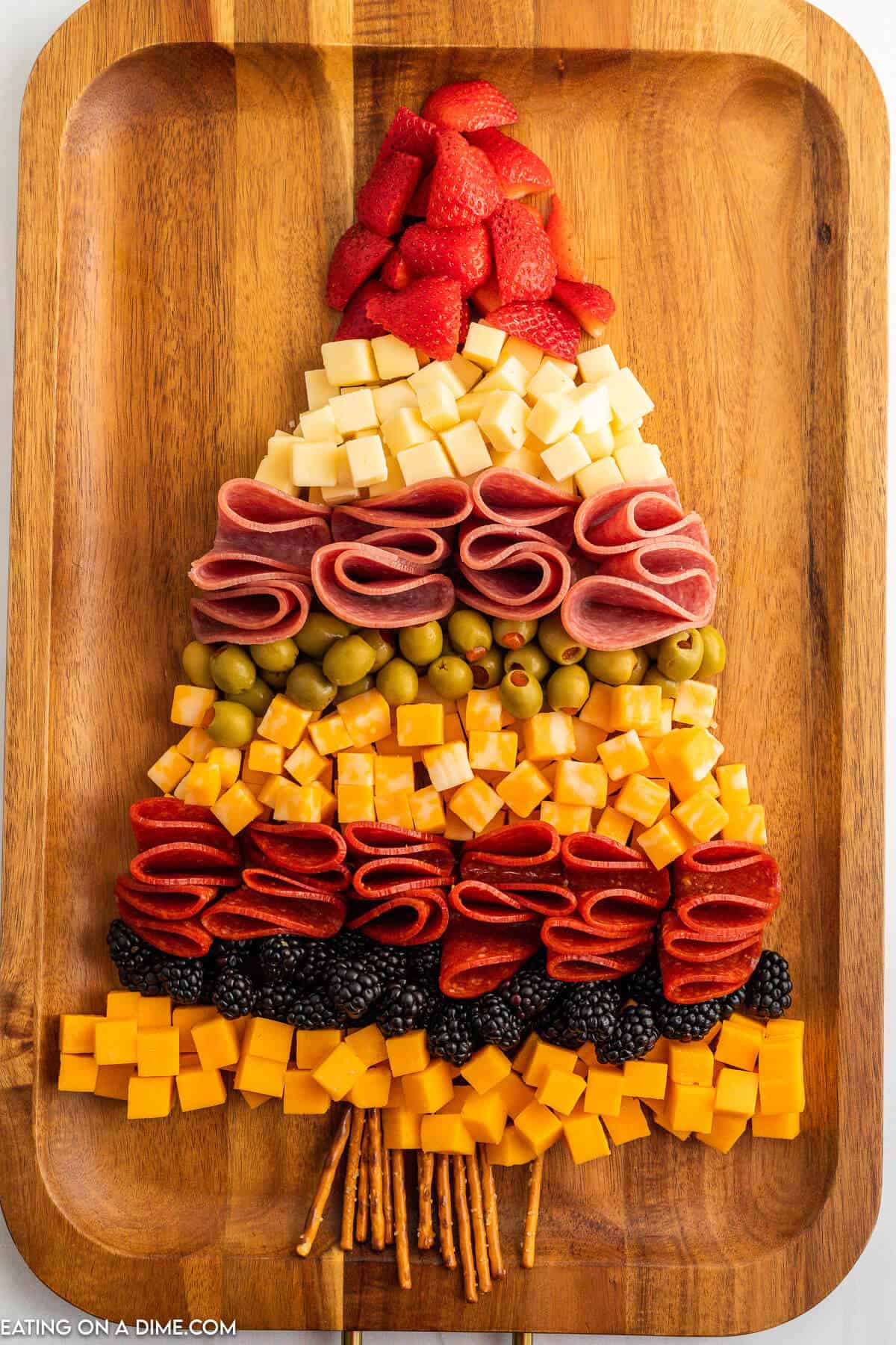 Layers of cheese and meat to form a tree. 