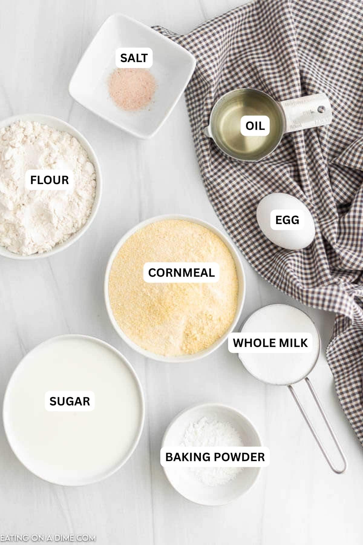 Ingredients for recipe: salt, oil, egg, flour, cornmeal, whole milk, sugar and baking powder.