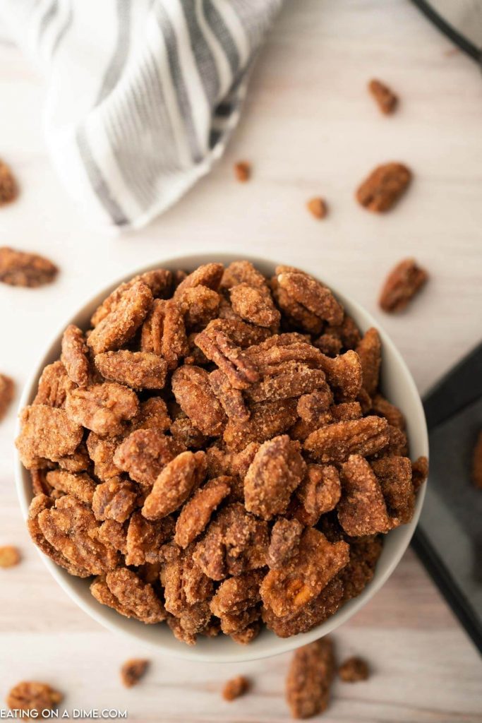 candied pecans on a white bowl