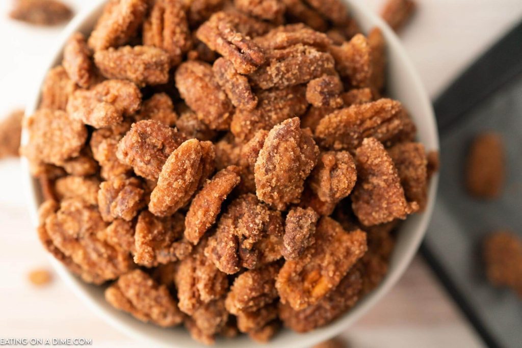 candied pecans on a white bowl
