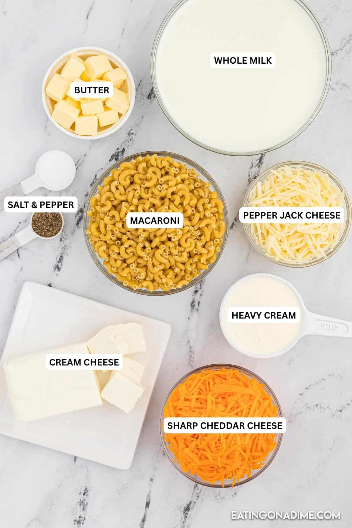 Ingredients for recipe: butter, whole milk, salt, pepper, macaroni, pepper jack cheese, cream cheese, heavy cream and cheddar cheese.