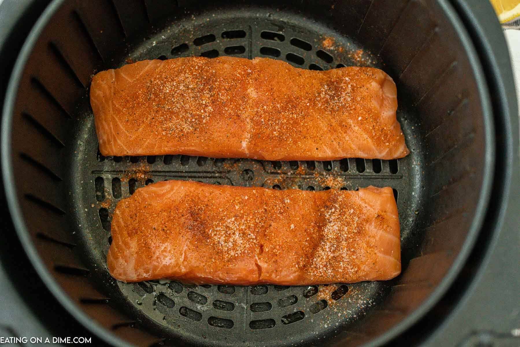 fresh salmon in an air fryer basket