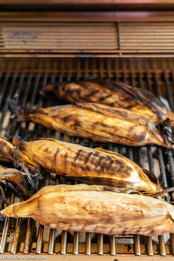 Grilled Corn in the Husk on the grill. 