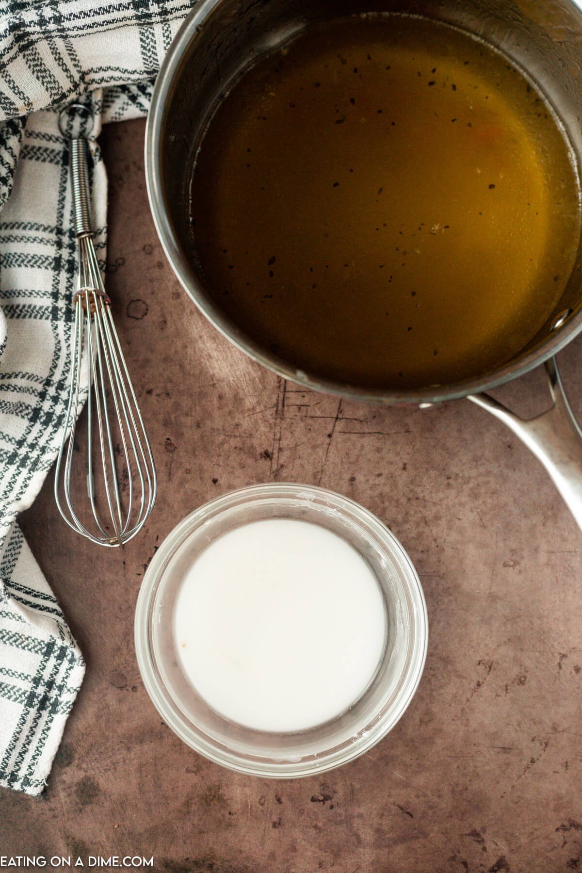 Cornstarch and cold water whisked together in a small mixing bowl.  